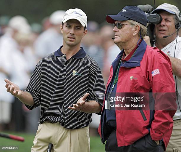 Mike Weir of the International team talks to Jack Nicklaus, captain of the U.S. Team, during the foursome matches in the third round of The...