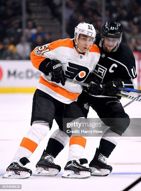 Valtteri Filppula of the Philadelphia Flyers and Anze Kopitar of the Los Angeles Kings bump as they follow play during opening night of the Los...