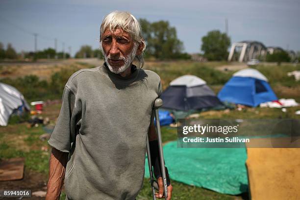 Don Gilsbach, a homeless man, stands in his camp at a homeless tent city April 13, 2009 in Sacramento, California. Hundreds of residents living in a...