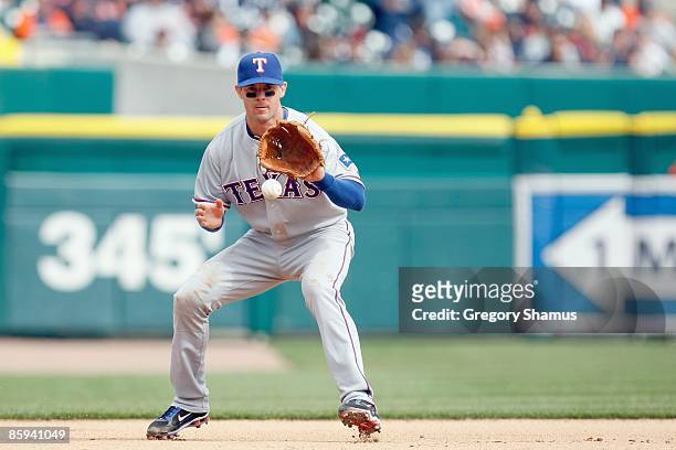 Michael Young of the Texas Rangers fields the ball against the Detroit Tigers during Opening Day on April 10, 2009 at Comerica Park in Detroit,...