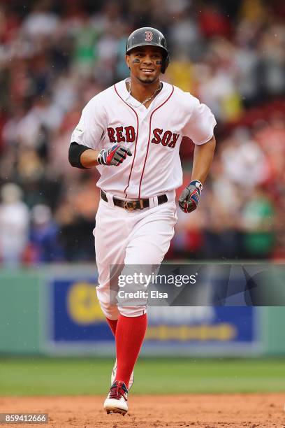 Xander Bogaerts of the Boston Red Sox runs the bases after hitting a solo home run in the first inning against the Houston Astros during game four of...