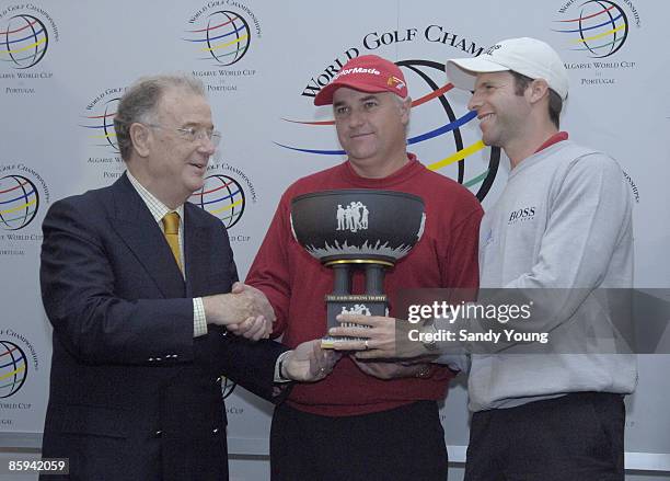 Stephen Dodd and Bradley Dredge of Wales receive the John Hopkins trophy from Jorge Sampaio, the President of Portugal, after winning the 2005...