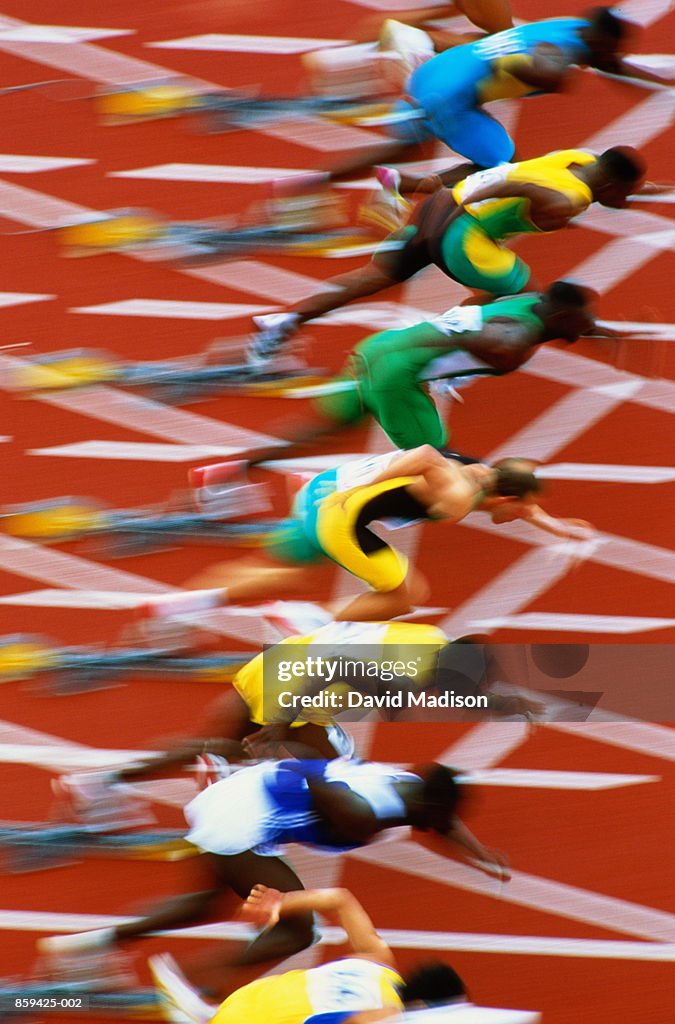 Athletics, runners at starting line (blurred motion)