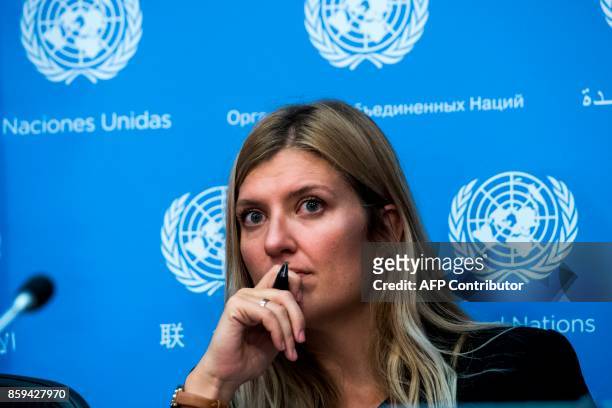 Nuclear disarmament group International Campaign to Abolish Nuclear Weapons executive director Beatrice Fihn listens to a question during a press...