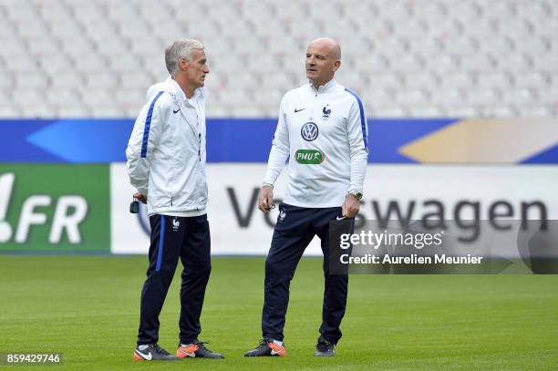 France Head Cocah Didier Deschamps and France Assistant Coach Guy Stephan speak during warm up before a France training session ahead of the France v...