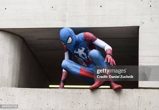 Comic Con cosplayer dressed as Spider-Man poses during the 2017 New York Comic Con - Day 4 on October 8, 2017 in New York City.