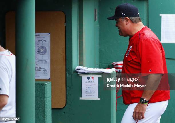 Manager John Farrell of the Boston Red Sox walks through the dugout after being ejected from game four of the American League Division Series against...