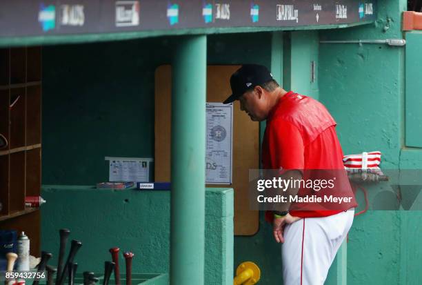 Manager John Farrell of the Boston Red Sox walks through the dugout after being ejected from game four of the American League Division Series against...