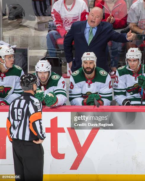 Head coach Bruce Boudreau of the Minnesota Wild argues a call to referee Gord Dwyer during the first ever NHL game against the Detroit Red Wings at...