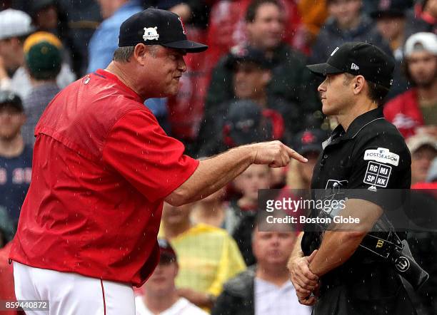 Boston Red Sox manager John Farrell argues a third called strike on Boston Red Sox second baseman Dustin Pedroia with the home plate umpire in the...