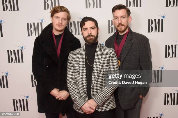 Jack Bevan, Yannis Philippakis and Edwin Congreave of Foals attend the BMI London Awards at The Dorchester on October 9, 2017 in London, England.