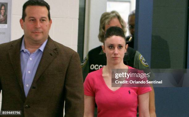 Attorney Jose Baez escorts Casey Anthony as she leaves the Orange County Corrections Facility on July 17 in Orlando, Fla.