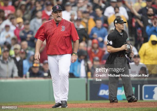 Manager John Farrell of the Boston Red Sox walks towards the dugout after being ejected by home plate umpire Mark Wegner against the Houston Astros...