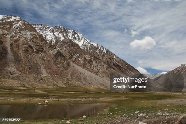 Remote Himalayan valley below snow-capped mountains in the village of Tsoltak, Ladakh, Jammu and Kashmir, India.