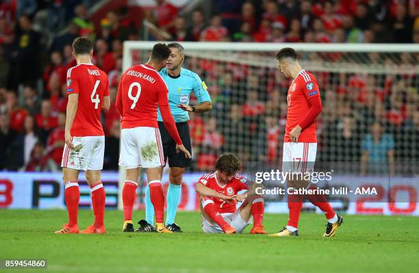 An injured Joe Allen of Wales during the FIFA 2018 World Cup Qualifier between Wales and Republic of Ireland at Cardiff City Stadium on October 9,...