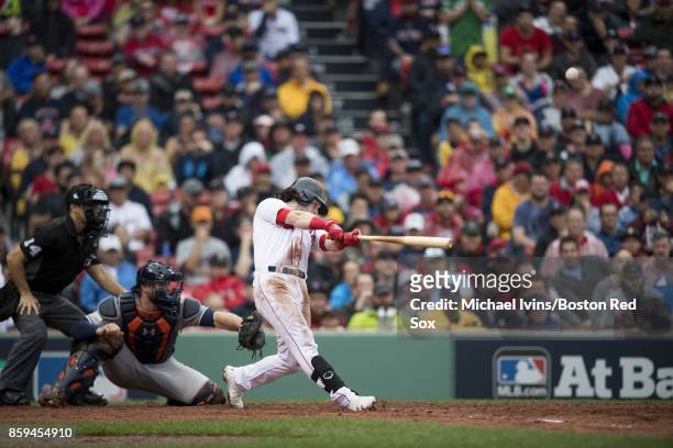 Andrew Benintendi of the Boston Red Sox hits a two-run home run against the Houston Astros in the fifth inning of game four of the American League...