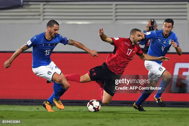 Albania's midfielder Eros Grezda vies with Italy's defender Leonardo Bonucci and Italy's defender Matteo Darmian during the FIFA World Cup 2018...