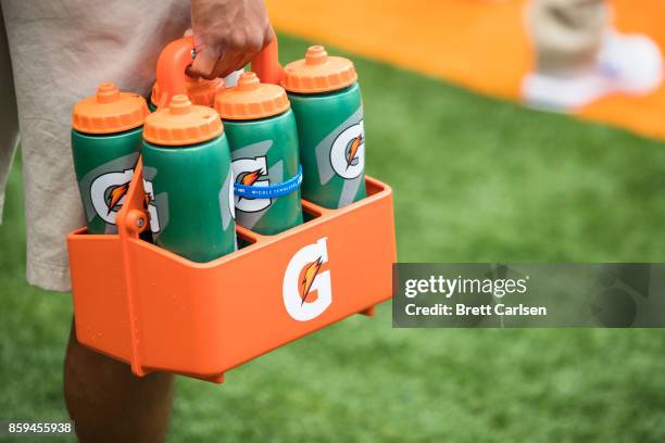 Member of team staff carries Gatorade water bottles before the game between the Syracuse Orange and the Middle Tennessee Blue Raiders on September 9,...