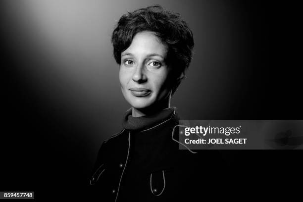 French novelist Alice Zeniter poses during a photo session in Paris on September 28, 2017. / BLACK AND WHITE VERSION