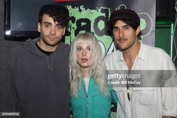 Taylor York, Hayley Williams and Zac Farro of Paramore pose at Radio 104.5 Performance Theater October 9, 2017 in Bala Cynwyd, Pennsylvania.