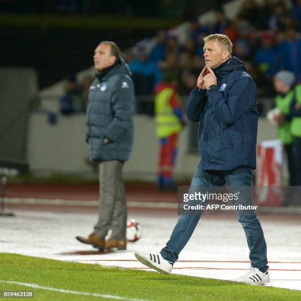 Iceland's coach Heimir Hallgrimsson stands follows the action on the sidelines during the FIFA World Cup 2018 qualification football match between...
