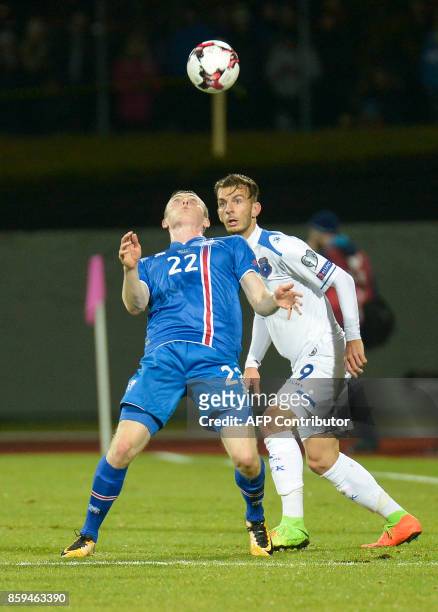 Iceland's forward Jon Dadi Bodvarsson and Kosovo's Bersant Celina vie for the ball during the FIFA World Cup 2018 qualification football match...