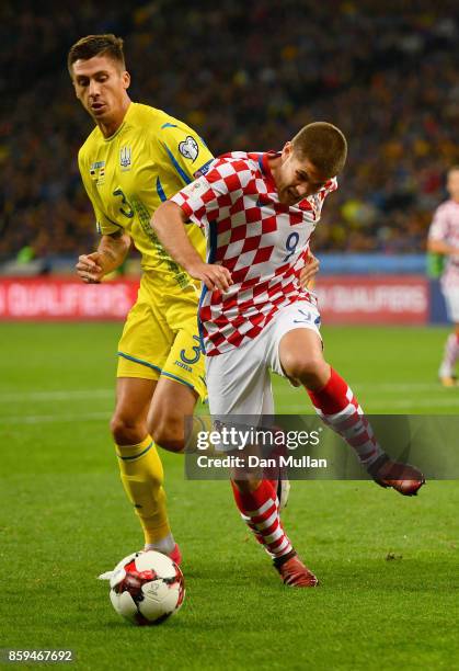 Andrej Kramaric of Croatia tangles with Yevhen Khacheridi of Ukraine during the FIFA 2018 World Cup Group I Qualifier between Ukraine and Croatia at...