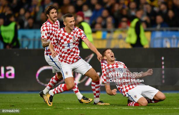 Andrej Kramaric of Croatia celebrates with Ivan Perisic and Sime Vrsaljko of Croatia as he scores their first goal during the FIFA 2018 World Cup...