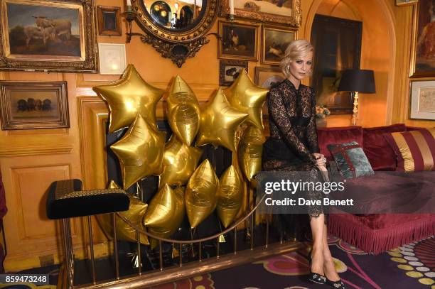Poppy Delevingne attends the Conde Nast Traveller 20th anniversary after party at Annabel's on October 9, 2017 in London, England.