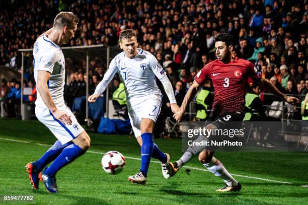 Finland's Robin Lod and Turkey's Ismail Köybasi during the FIFA World Cup 2018 qualification football match between Finland and Turkey in Turku,...