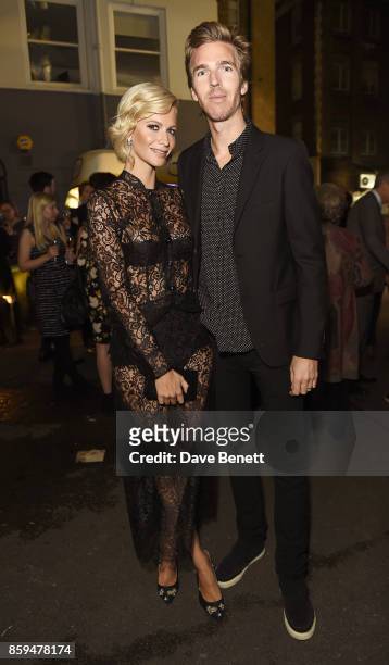 Poppy Delevingne and James Cook attend the Conde Nast Traveller 20th anniversary party at Vogue House on October 9, 2017 in London, England.