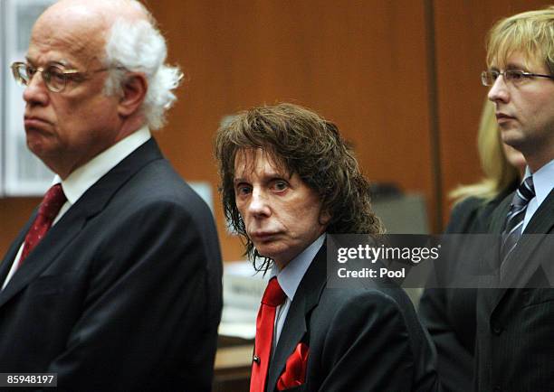 Phil Spector flanked by his lawyers Doran Weinberg and Tran Smith looks at the jury as it they arrive before the verdict was read at Los Angeles...