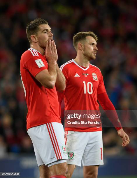 Sam Vokes and Aaron Ramsey react after the FIFA 2018 World Cup Qualifier between Wales and Republic of Ireland at Cardiff City Stadium on October 9,...