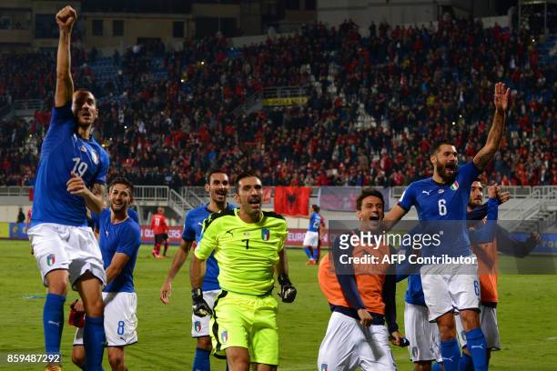 Italy's players celebrate after winning the FIFA World Cup 2018 qualification football match between Albania and Italy at Loro Borici Stadium in...