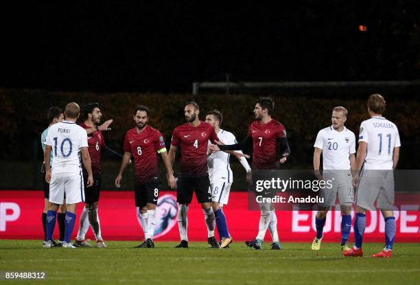 Okay Yokuslu of Turkey receives yellow card during the 2018 FIFA World Cup European Qualification Group I match between Finland and Turkey at Veritas...