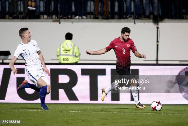 Ismail Koybasi of Turkey in action against Juha Pirinen of Finland during the 2018 FIFA World Cup European Qualification Group I match between...