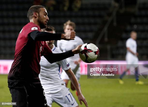 Cenk Tosun of Turkey in action against Juha Pirinen of Finland during the 2018 FIFA World Cup European Qualification Group I match between Finland...