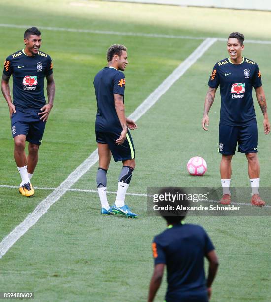 Paulinho, Neymar and Firmino of Brazil gesture during the Brazil training session for 2018 FIFA World Cup Russia Qualifier match against Chile at...