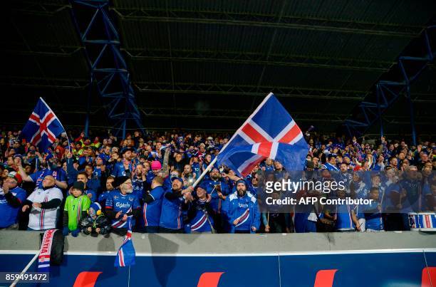 Iceland's fans celebrates at the FIFA World Cup 2018 qualification football match between Iceland and Kosovo in Reykjavik, Iceland on October 9,...