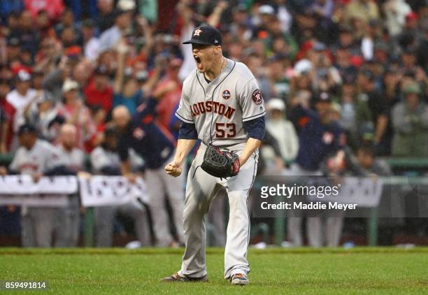 Ken Giles of the Houston Astros celebrates after recording the final out in the ninth inning to defeat the Boston Red Sox 5-4 in game four of the...