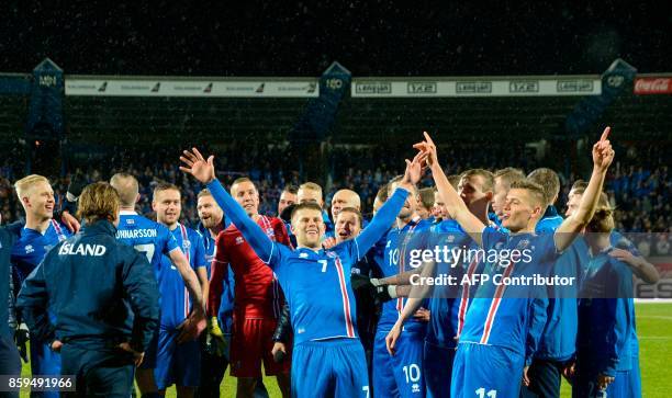 Iceland's players celebrate after the FIFA World Cup 2018 qualification football match between Iceland and Kosovo in Reykjavik, Iceland on October 9,...