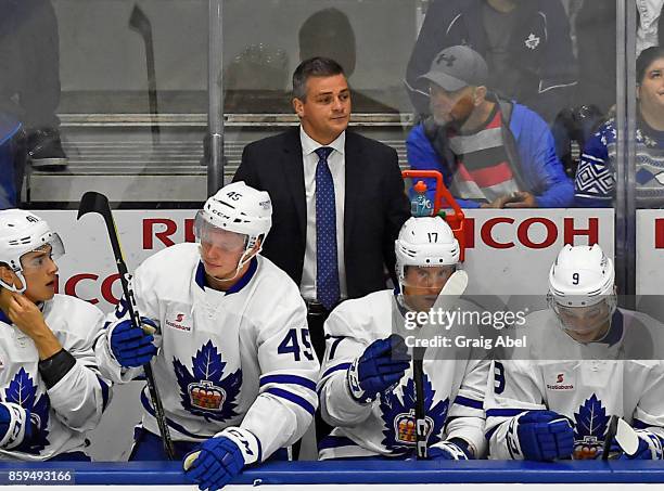 Head coach Sheldon Keefe of the Toronto Marlies watches the play develop against the Utica Comets during AHL game action on October 7, 2017 at Ricoh...