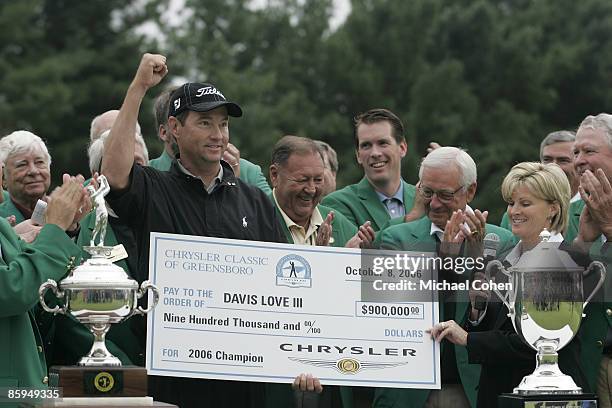 Davis Love III receives the winner's cheque after the fourth and final round of the Chrysler Classic of Greensboro at Forest Oaks Country Club in...