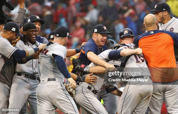 The Houston Astros celebrate defeating the Boston Red Sox 5-4 in game four of the American League Division Series at Fenway Park on October 9, 2017...
