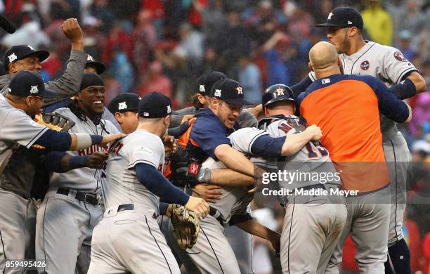 The Houston Astros celebrate defeating the Boston Red Sox 5-4 in game four of the American League Division Series at Fenway Park on October 9, 2017...