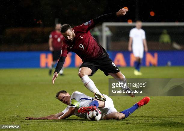 Cenk Tosun of Turkey in action against Niklas Moisander of Finland during the 2018 FIFA World Cup European Qualification Group I match between...