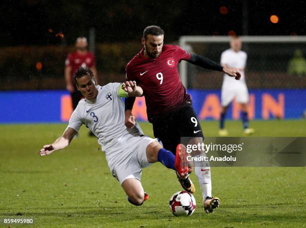 Cenk Tosun of Turkey in action against Niklas Moisander of Finland during the 2018 FIFA World Cup European Qualification Group I match between...