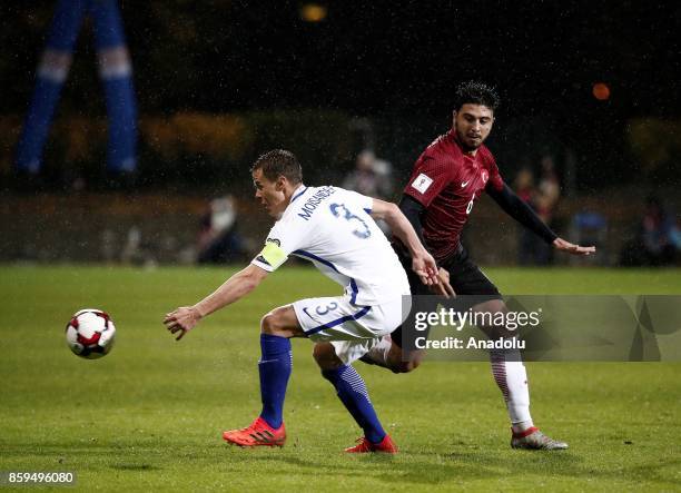 Ozan Tufan of Turkey in action against Niklas Moisander of Finland during the 2018 FIFA World Cup European Qualification Group I match between...