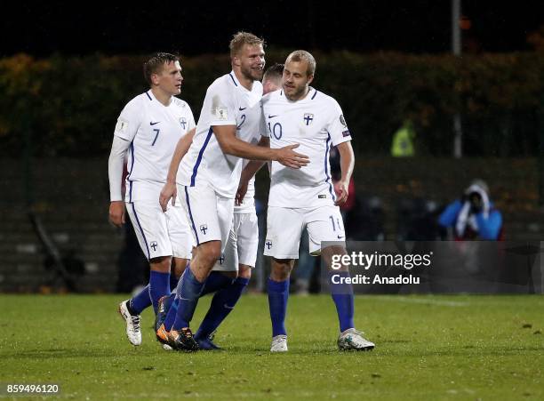 Paulus Arajuuri of Finland celebrates with his teammates after scoring during the 2018 FIFA World Cup European Qualification Group I match between...