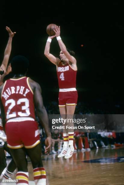 Rick Barry of the Houston Rockets shoots a jump shot against the Washington Bullets during a circa 1978 NBA basketball game at the Capital Center in...